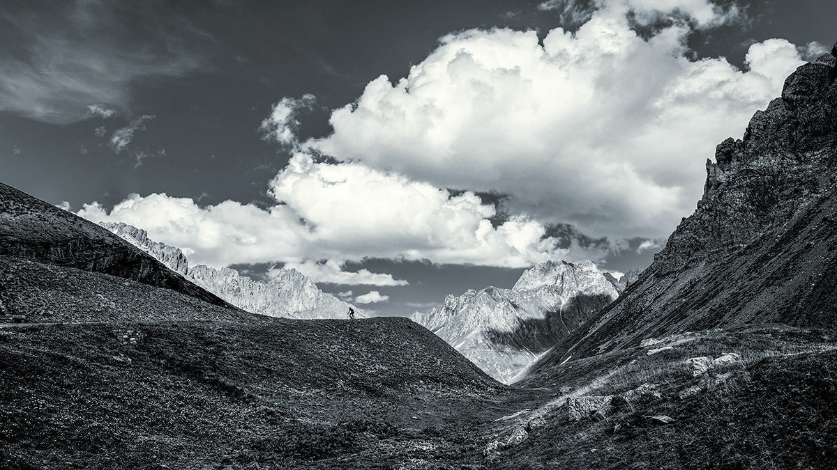 Cyclist traversing the dramatic landscape of the Galibier during Tour de France Galibier 2006.