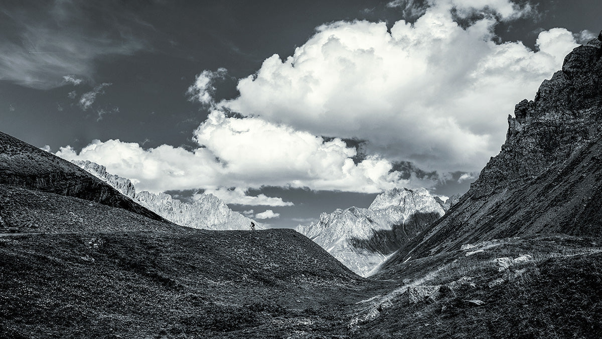 Cyclist traversing the dramatic landscape of the Galibier during Tour de France Galibier 2006.
