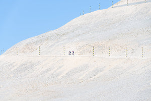 Mont Ventoux - 2 Riders climb the famous Ventoux bleached mountainside in the mid-morning sunshine. Cycling photography prints by davidt.