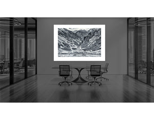 The Road Down to Bormio - b & w black and white cycling photography print displayed in a modern office setting.