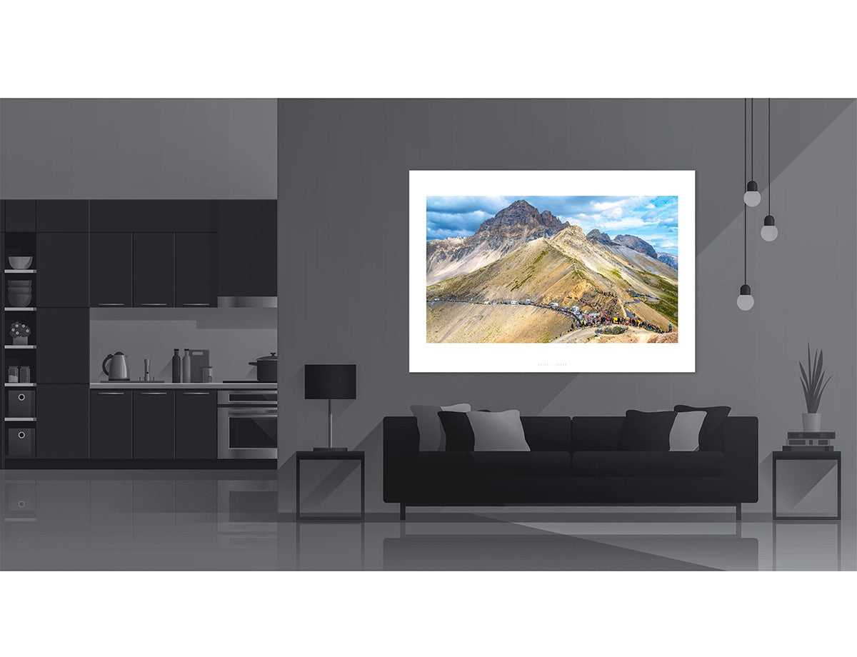 Le Grand Galibier Cycling Art Print displayed in a modern living room setting, showcasing stunning mountain views.
