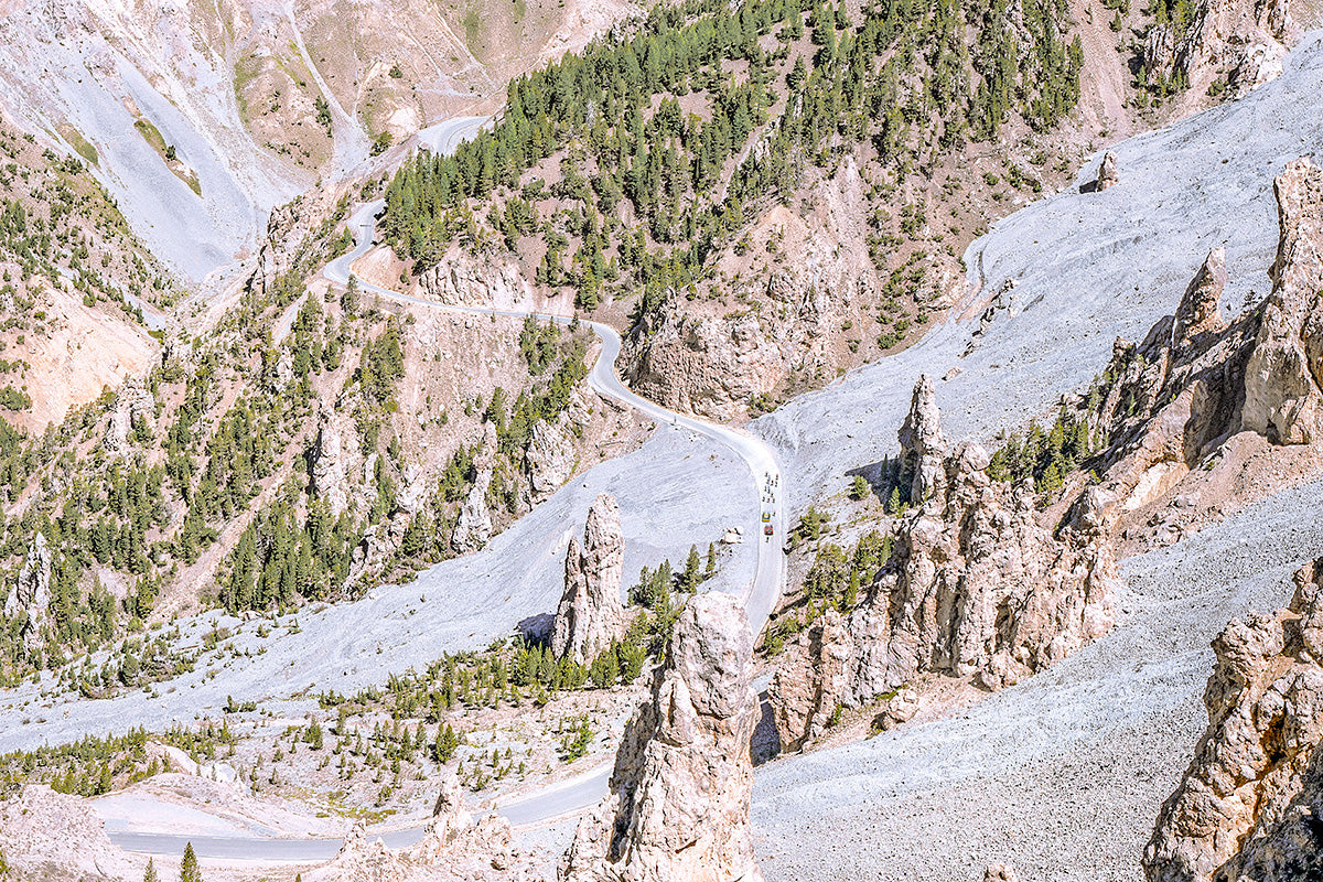 Col d'Izoard - Race Day Cycling photography print featuring a winding mountain road and rugged terrain.