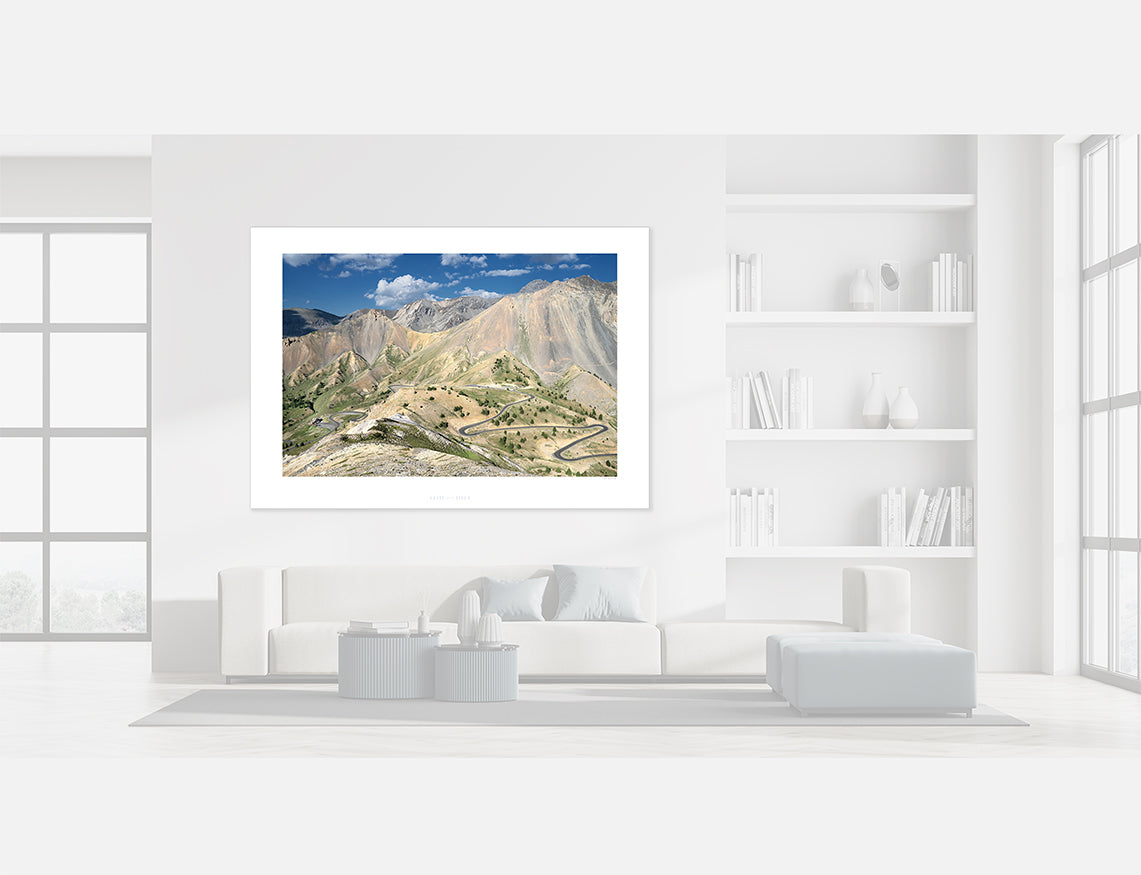 Col d'Izoard Summit Cycling Art Print framed in modern living room with mountain landscape view.