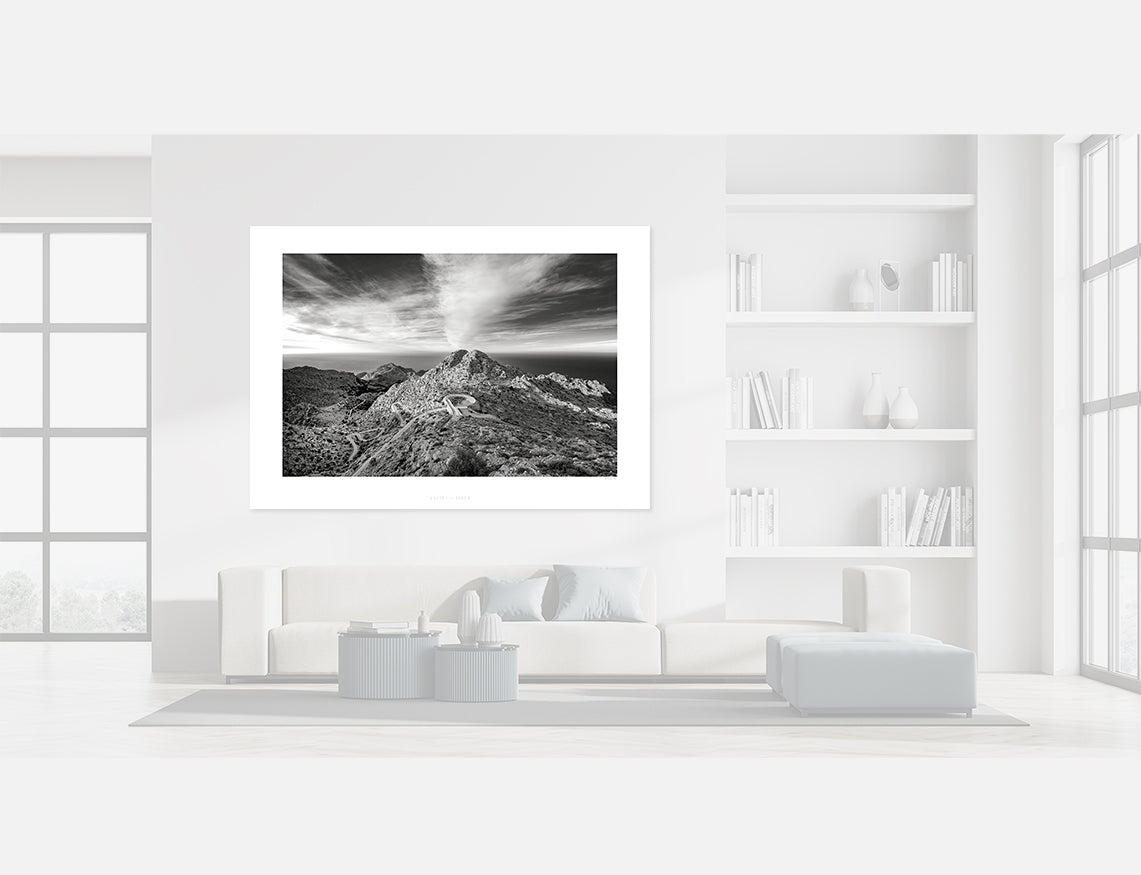 Sa Calobra - From the Top - b & w photography print displayed in a modern living room interior.