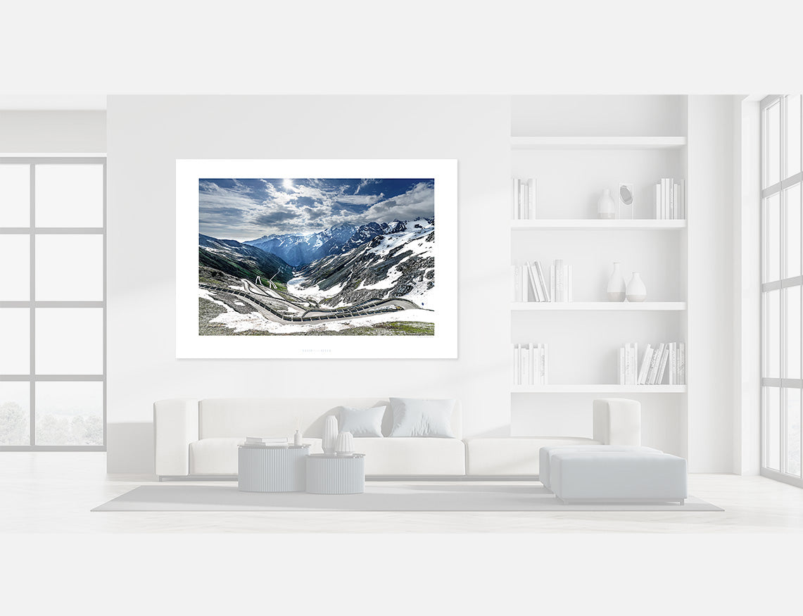 Stelvio Pass - Stairway to Heaven wall art displayed in a modern living room with white interior design.