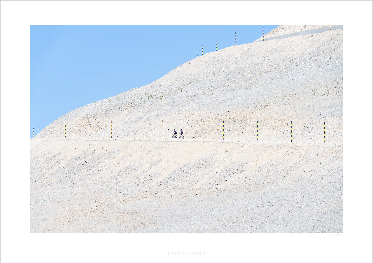 Mont Ventoux - 2 Riders climb the famous Ventoux  bleached mountainside in the mid-morning sunshine